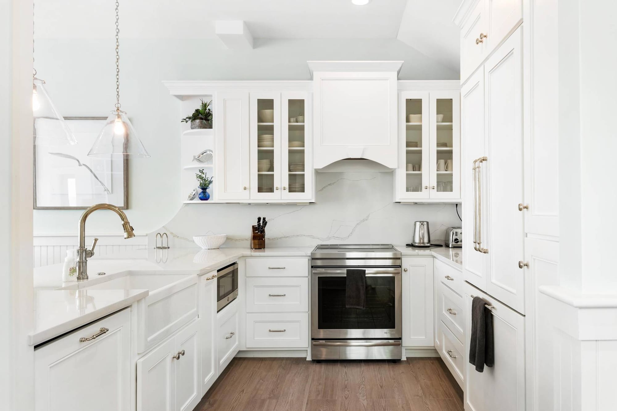 Modern white kitchen with cabinetry.