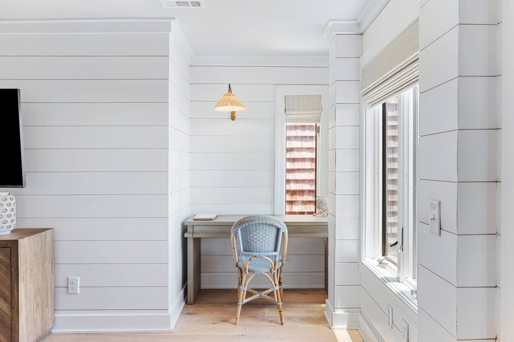 Minimalist desk nook with chair.