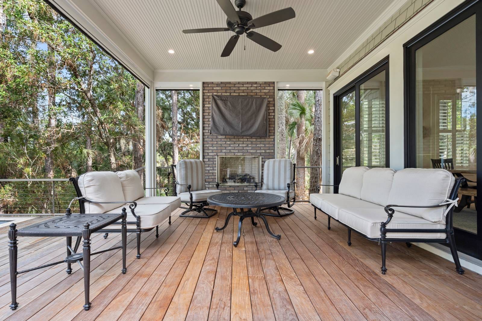 Outdoor patio with seating and fireplace.