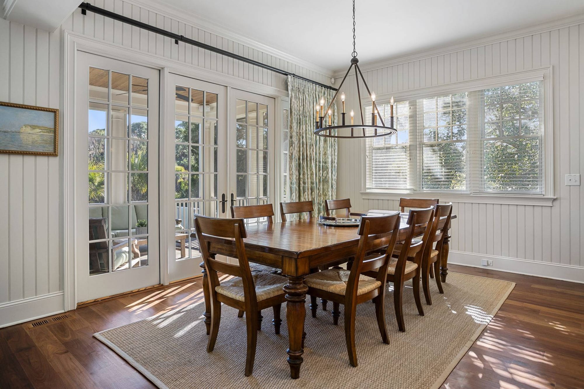 Elegant dining room with wooden table.