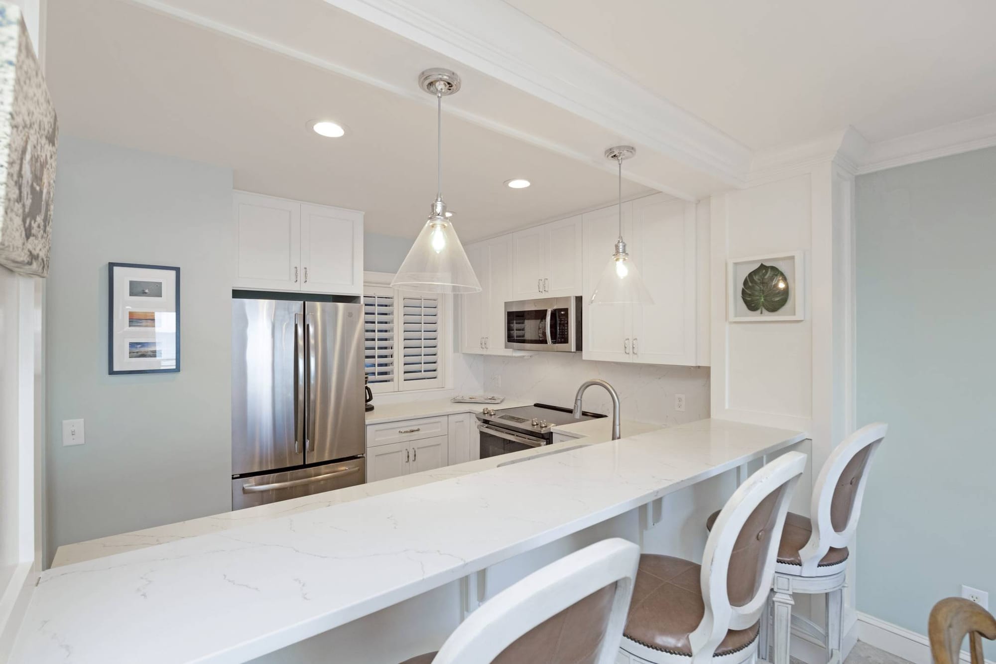 Modern kitchen with white decor.