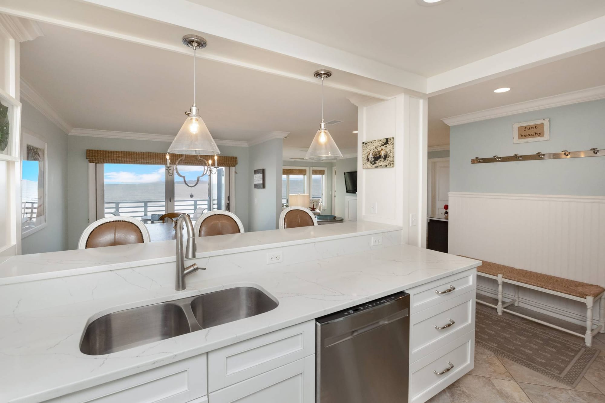 Open kitchen with marble countertops.