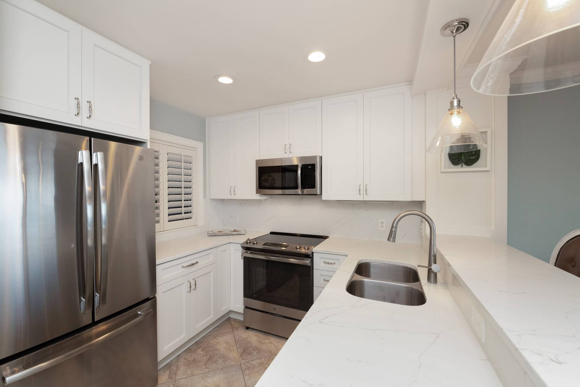 Modern kitchen with stainless steel appliances.