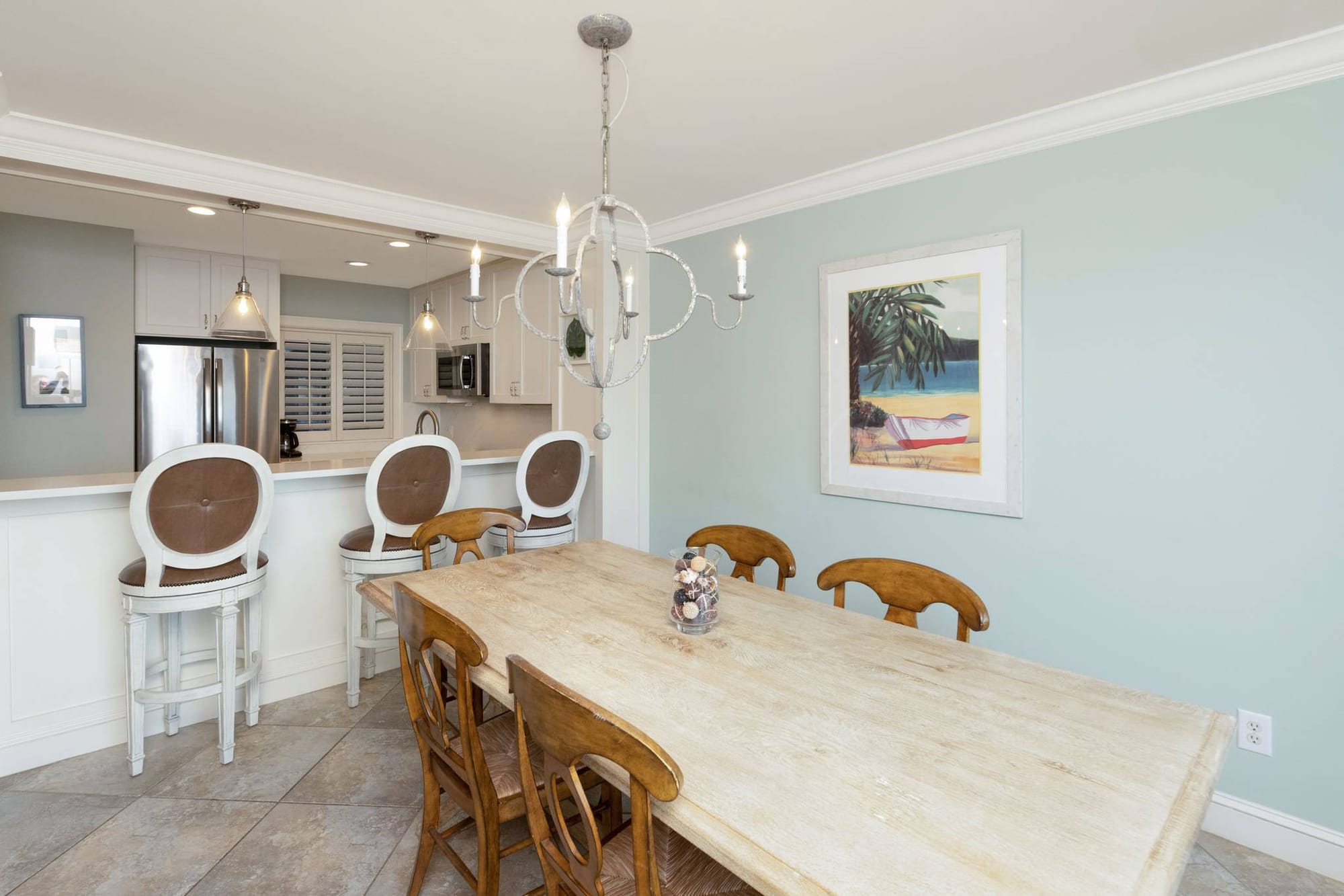 Beach-themed dining and kitchen area.