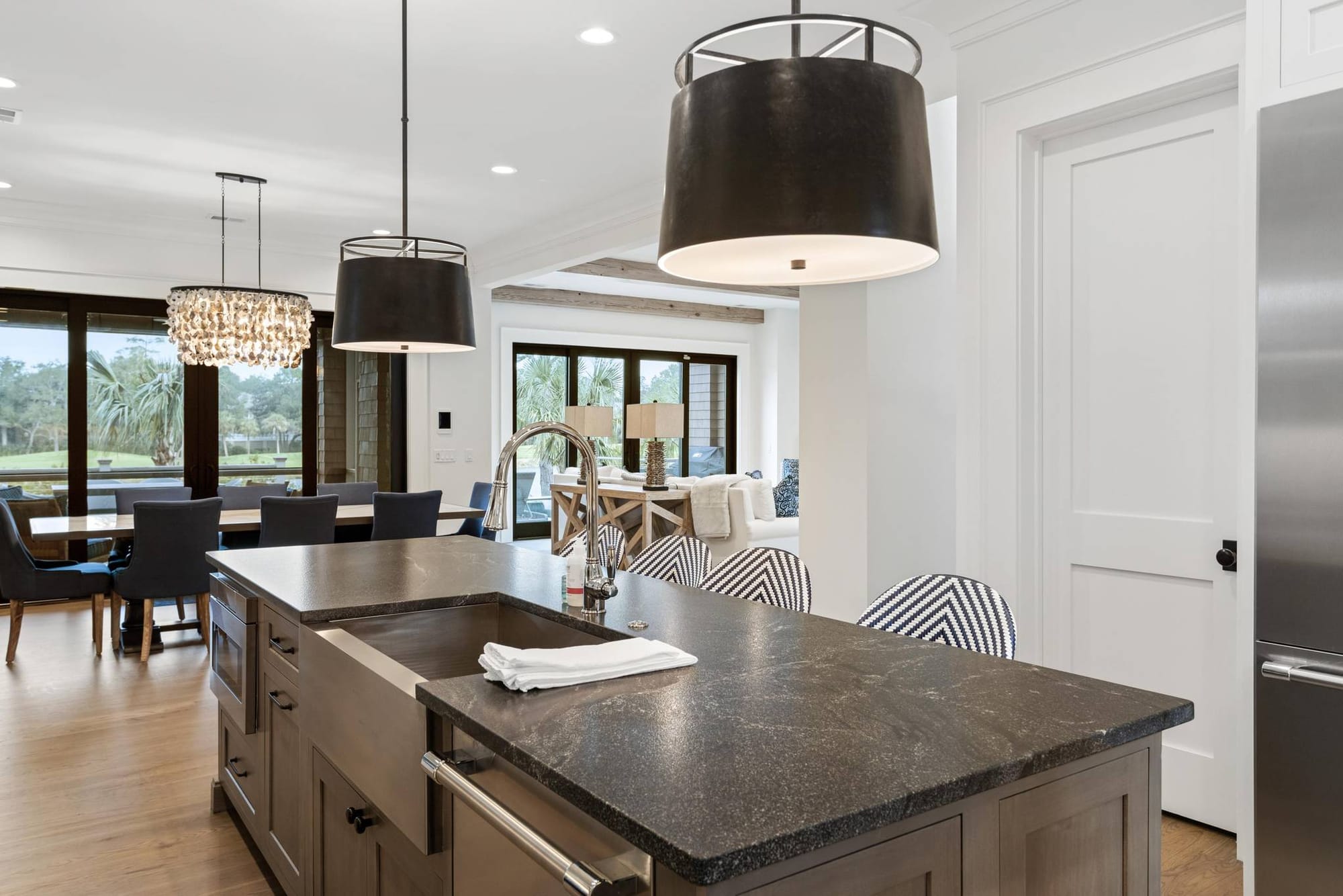 Modern kitchen with island and lights.