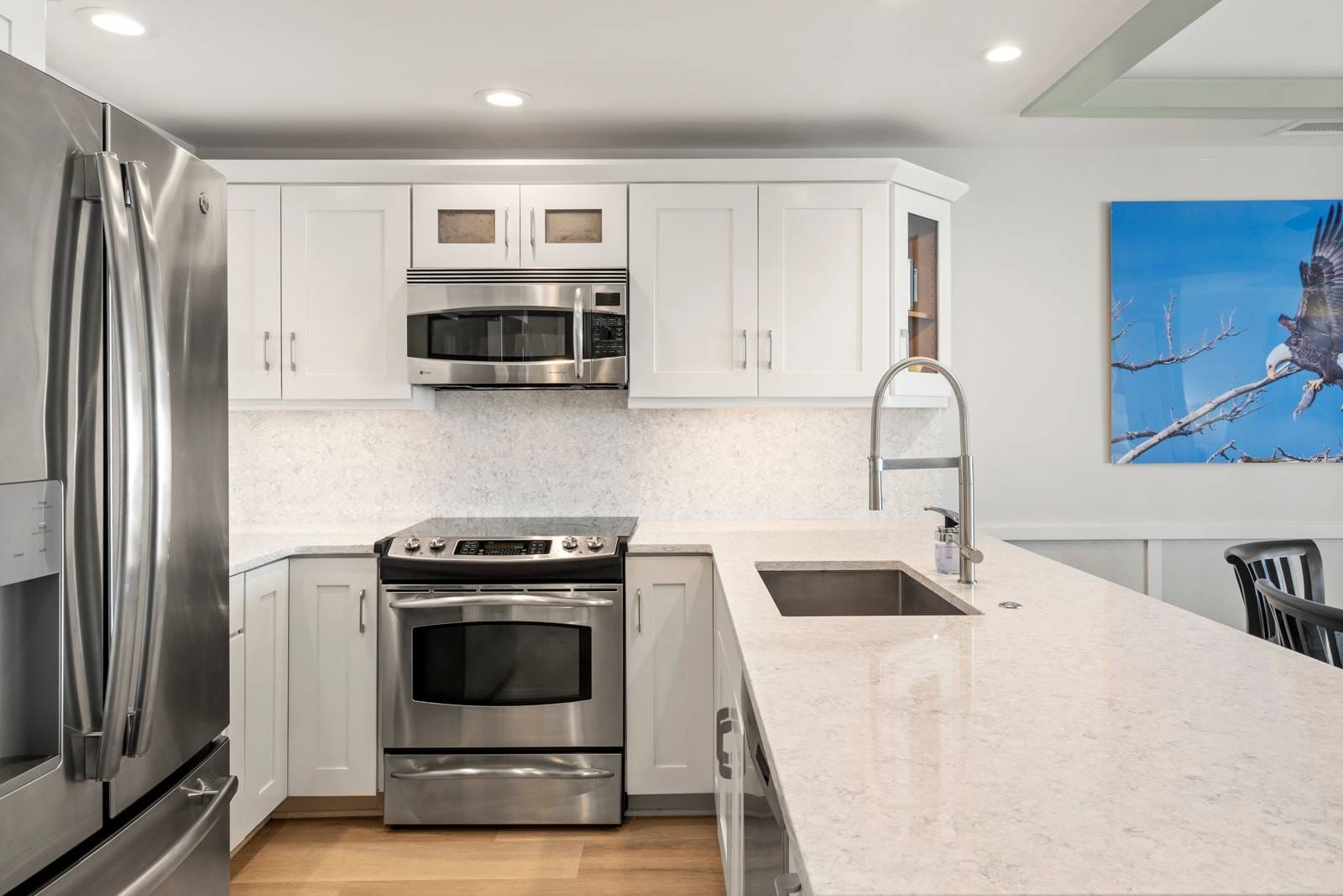 Modern kitchen with stainless steel appliances.