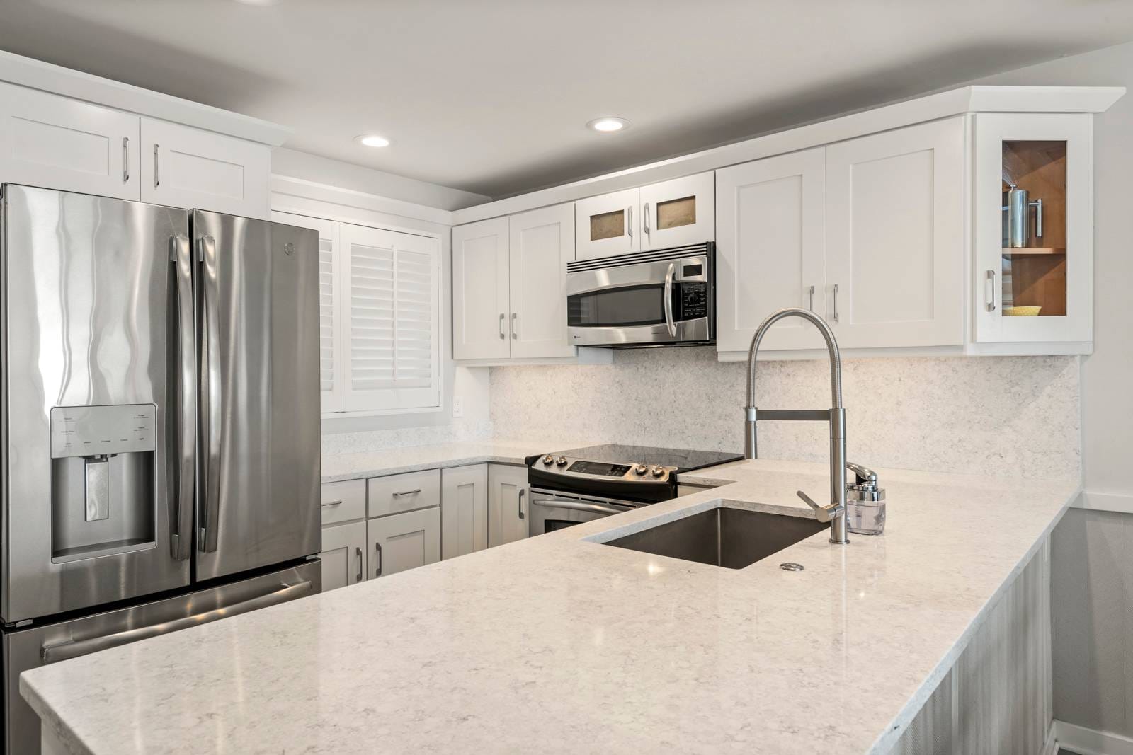 Modern kitchen with stainless steel appliances.