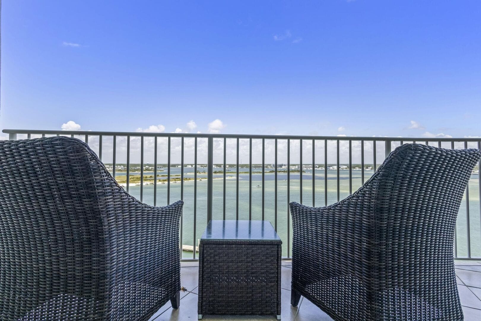 Two chairs overlooking ocean view.