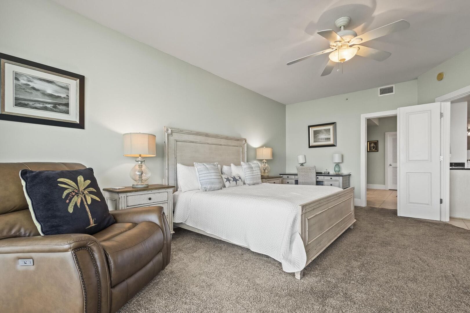 Spacious bedroom with neutral decor.