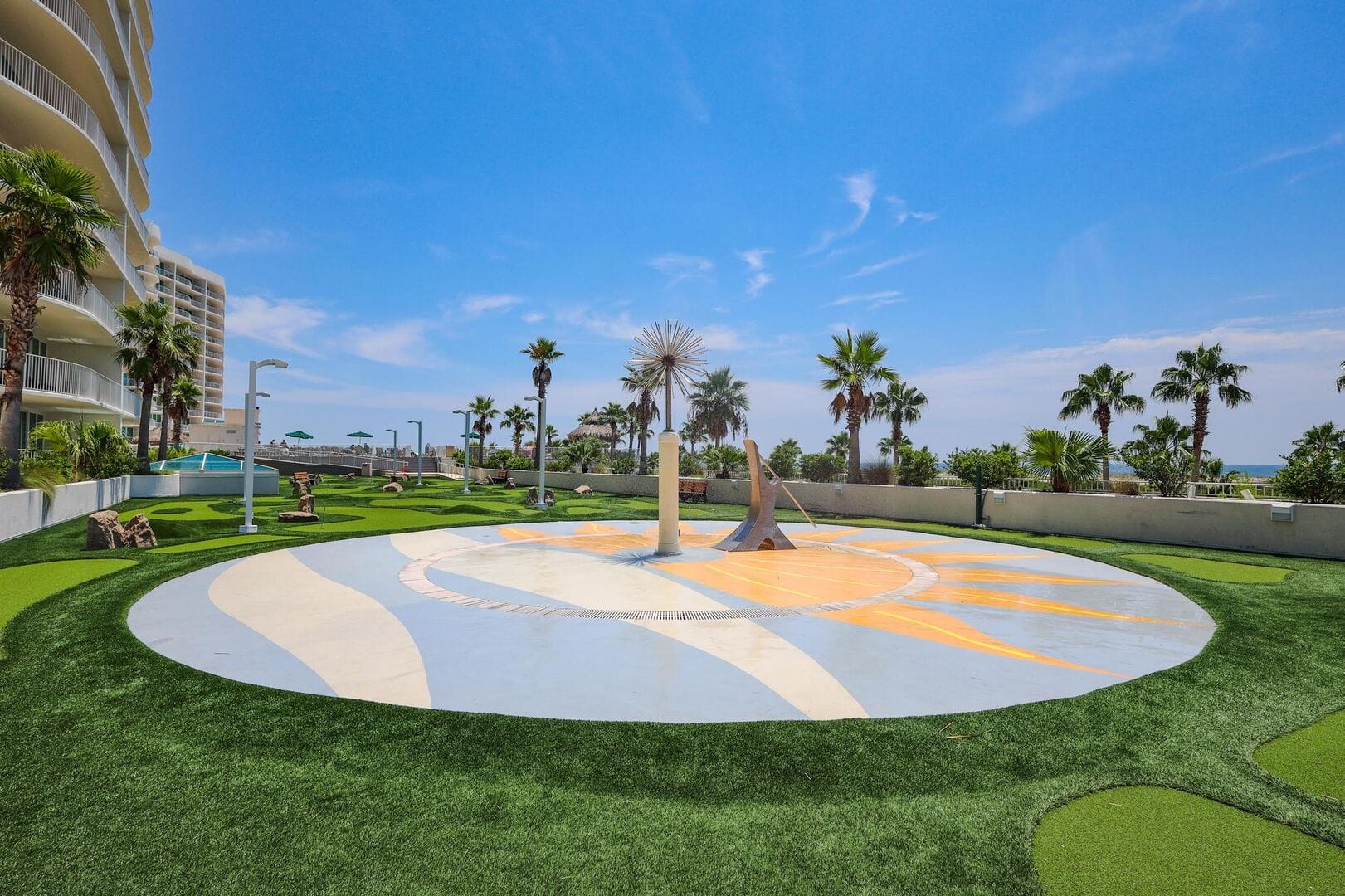 Rooftop park with palm trees.