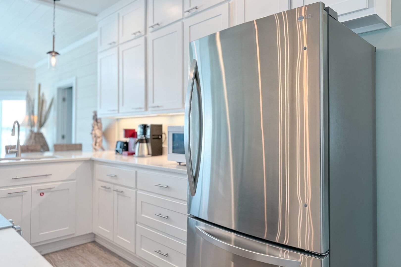 Modern kitchen with stainless steel appliances.