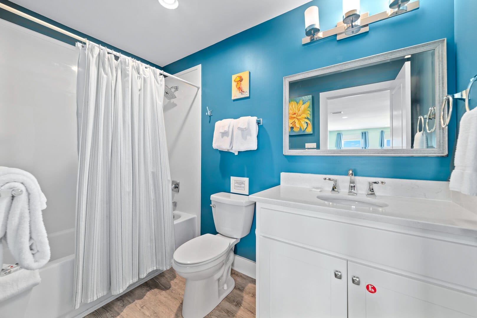 Bright bathroom with blue walls.