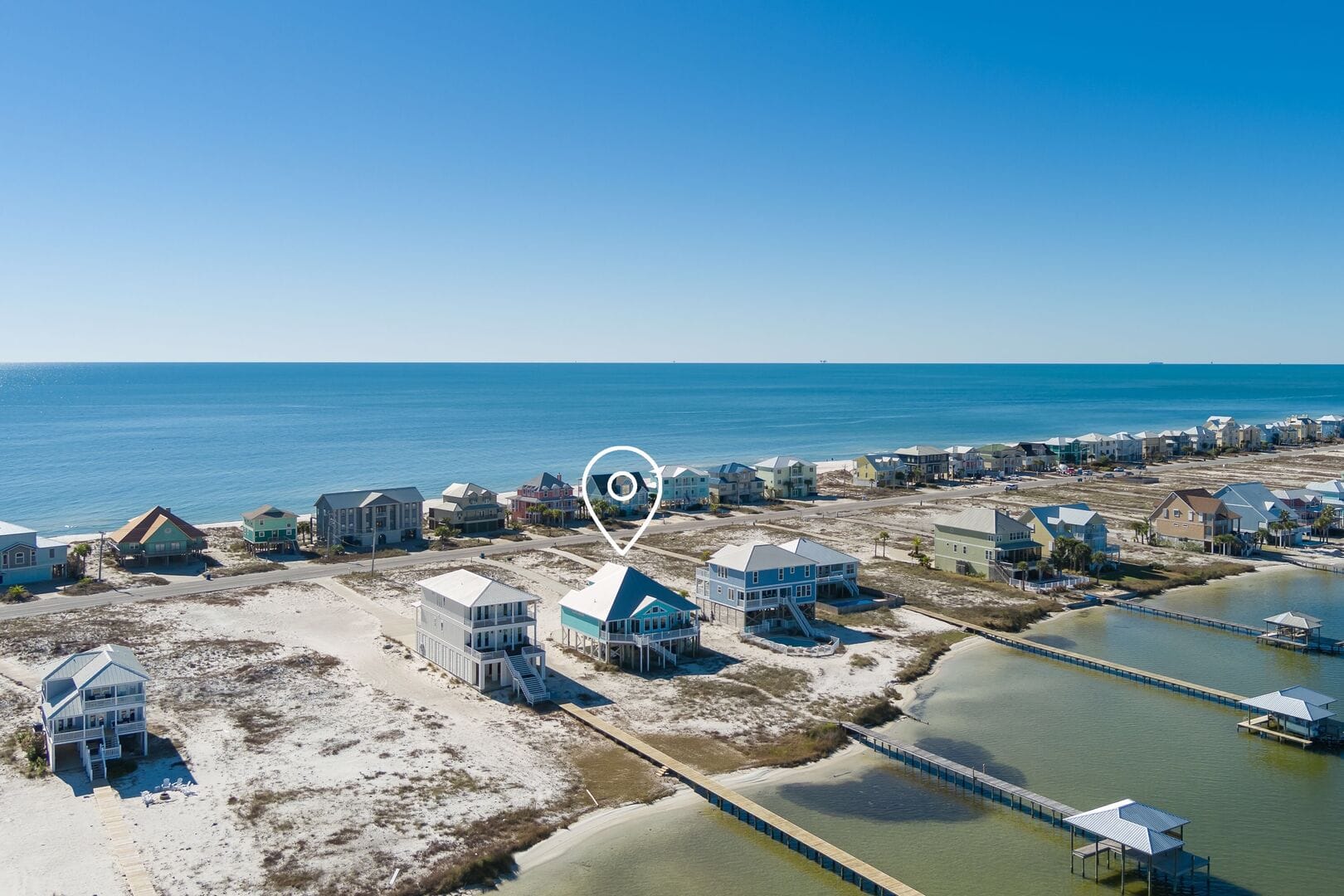 Coastal homes by blue ocean.