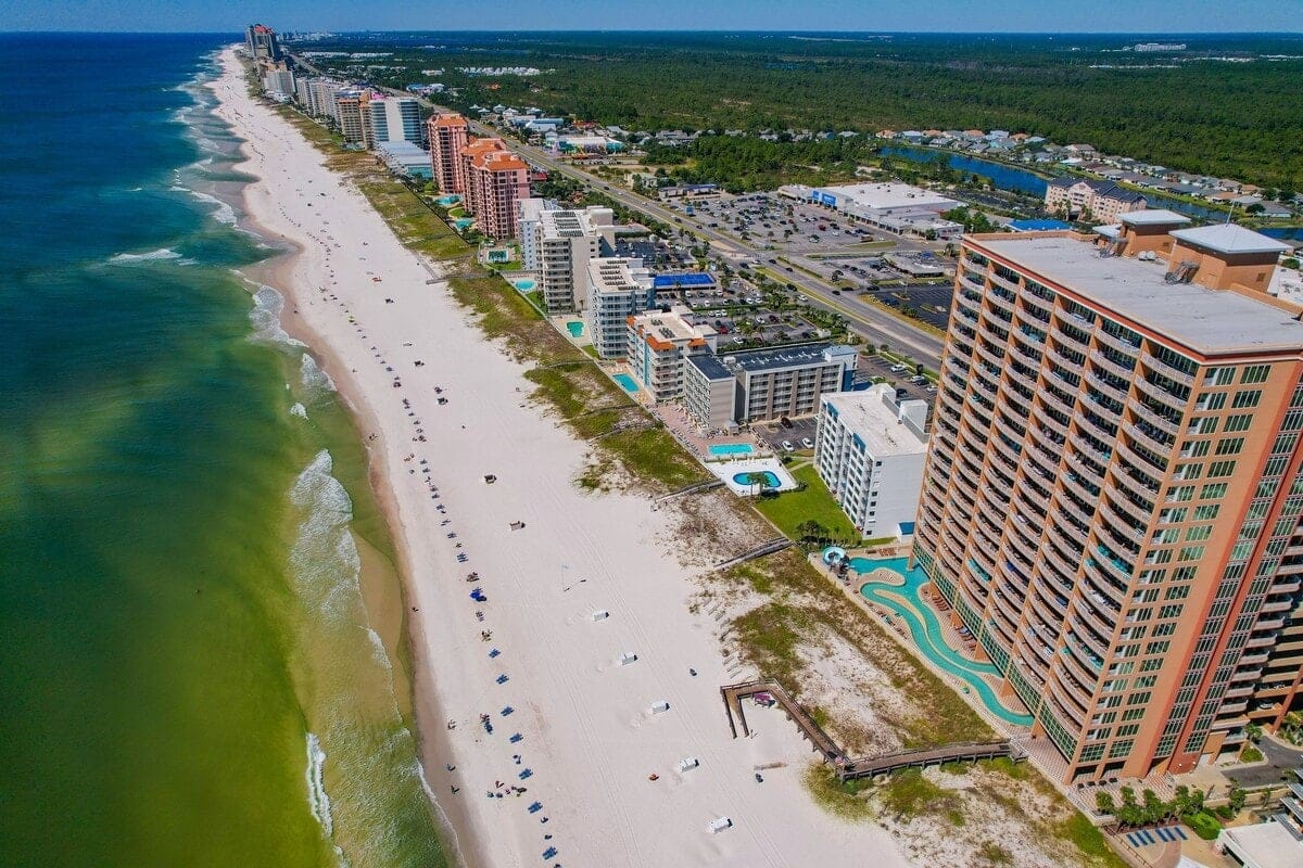 Beachside buildings and coastline aerial view.