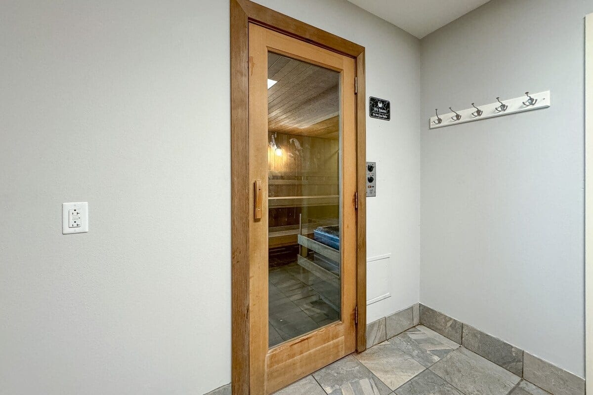 Sauna room with closed glass door.