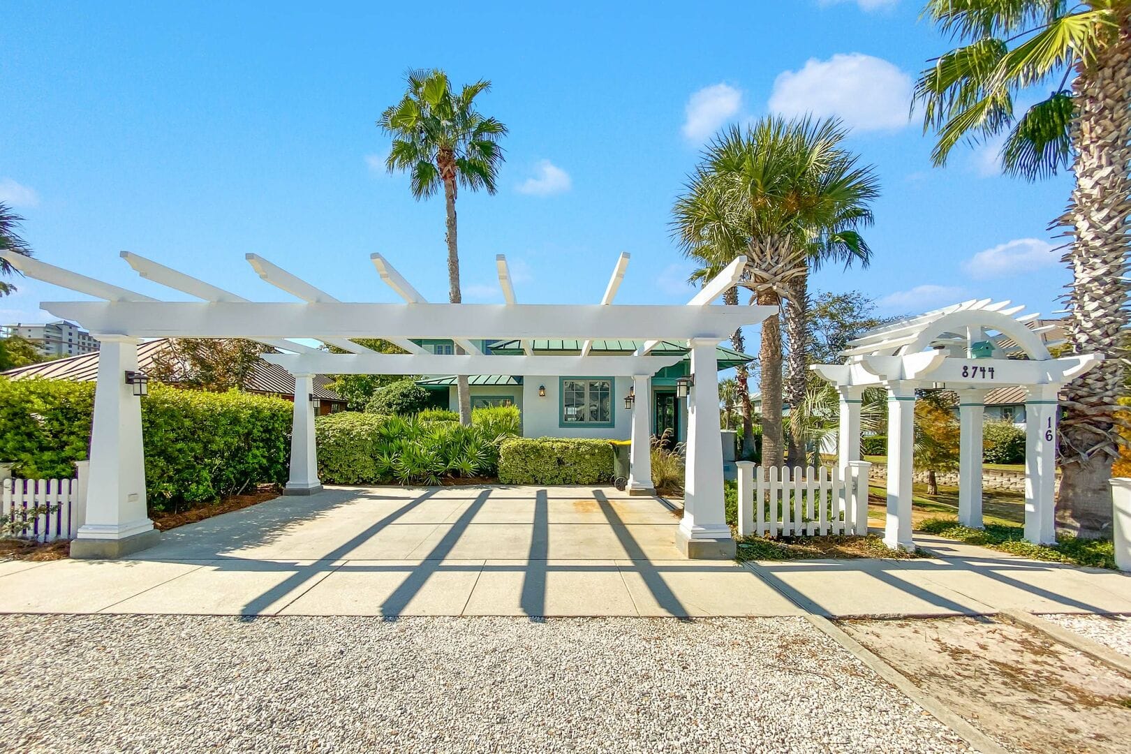 Beach house with palm trees.