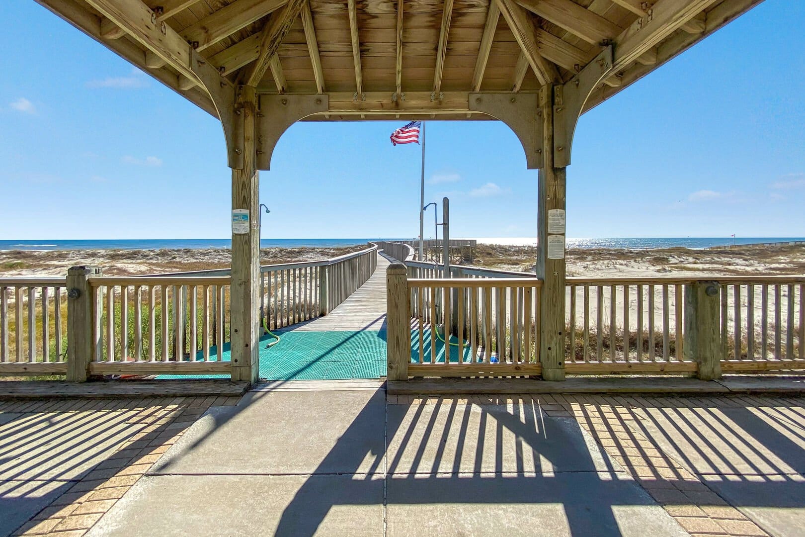 Boardwalk leading to beach view.