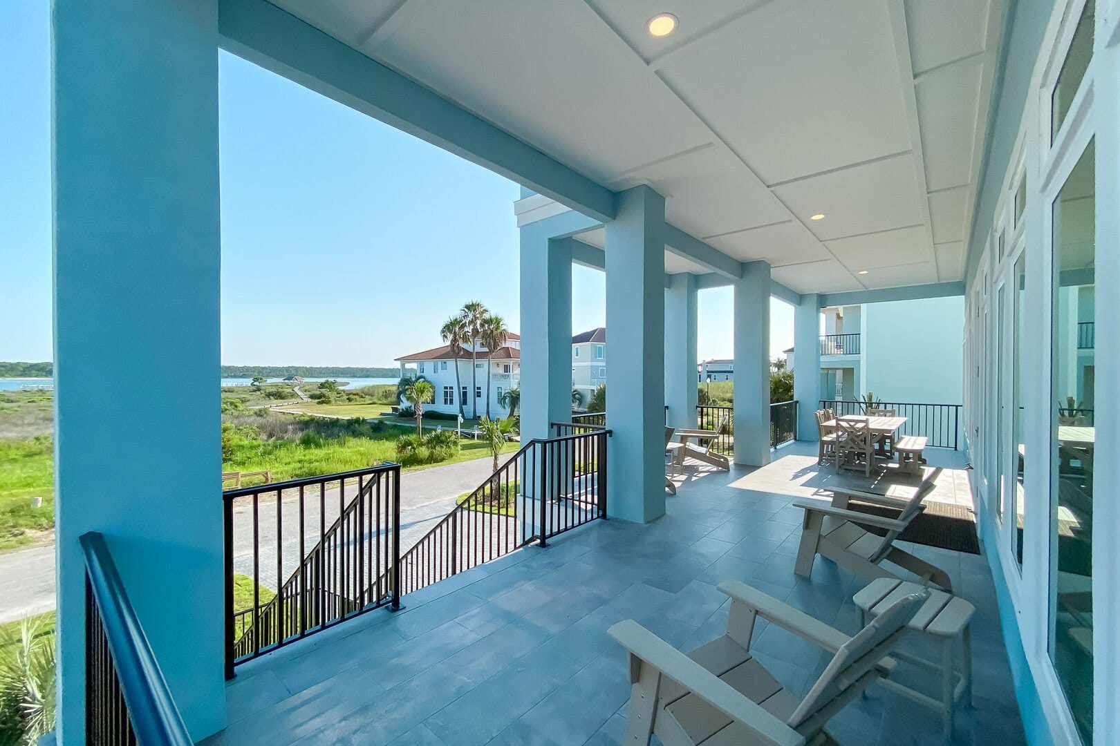 Coastal porch with seating, view.