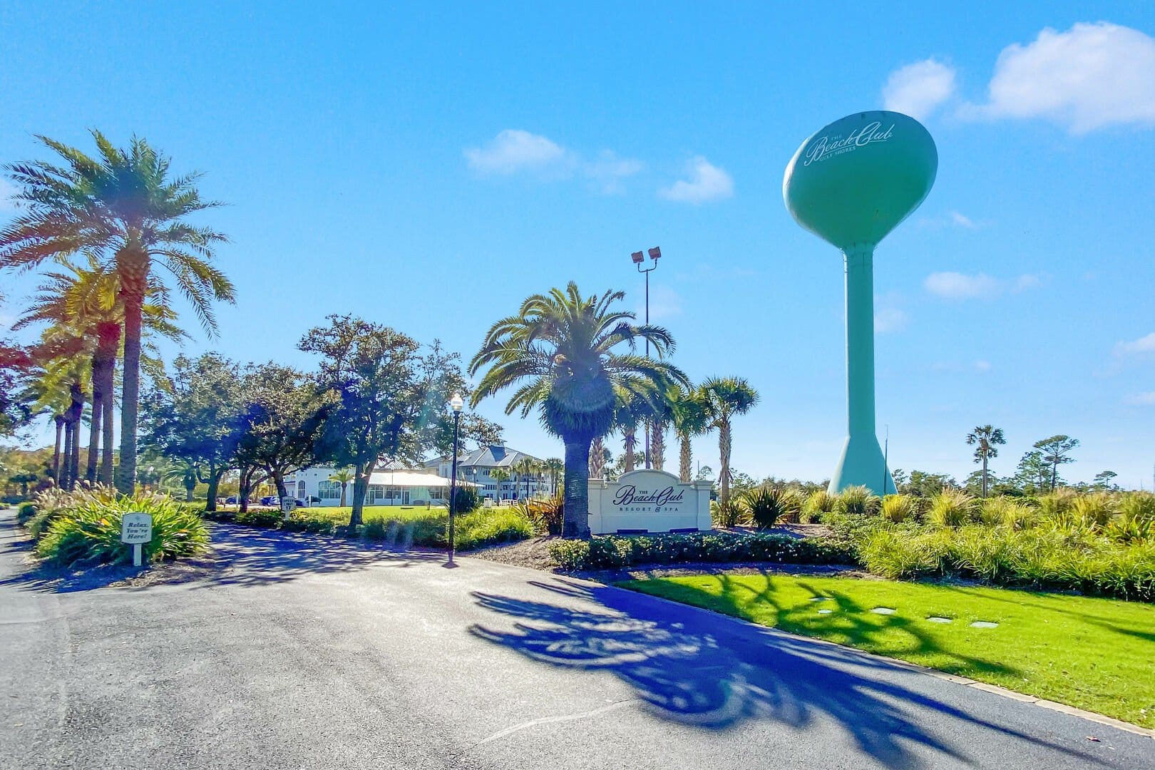 Palm trees and water tower entrance.