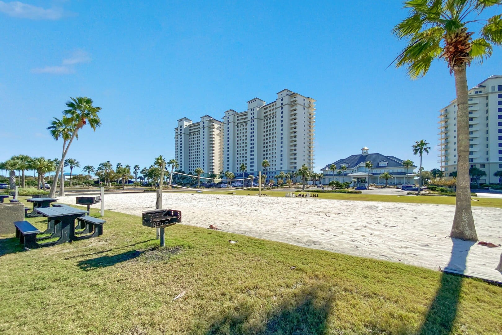 Resort buildings with volleyball court.