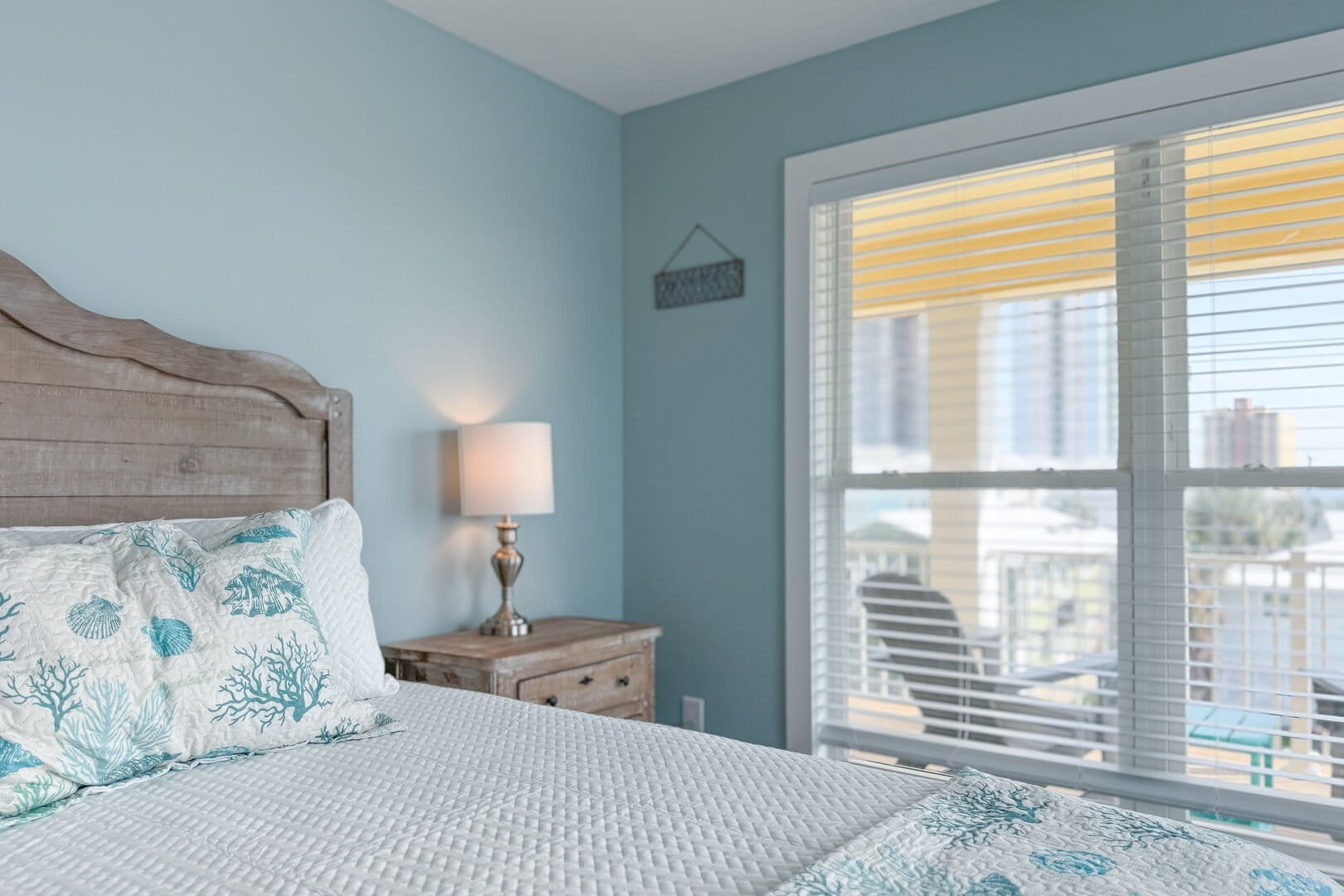 Cozy bedroom with sea-themed decor.