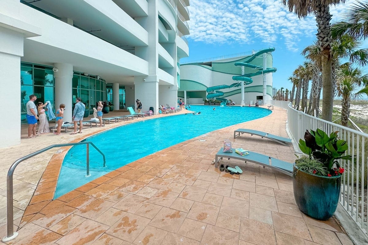 Outdoor pool with water slide.