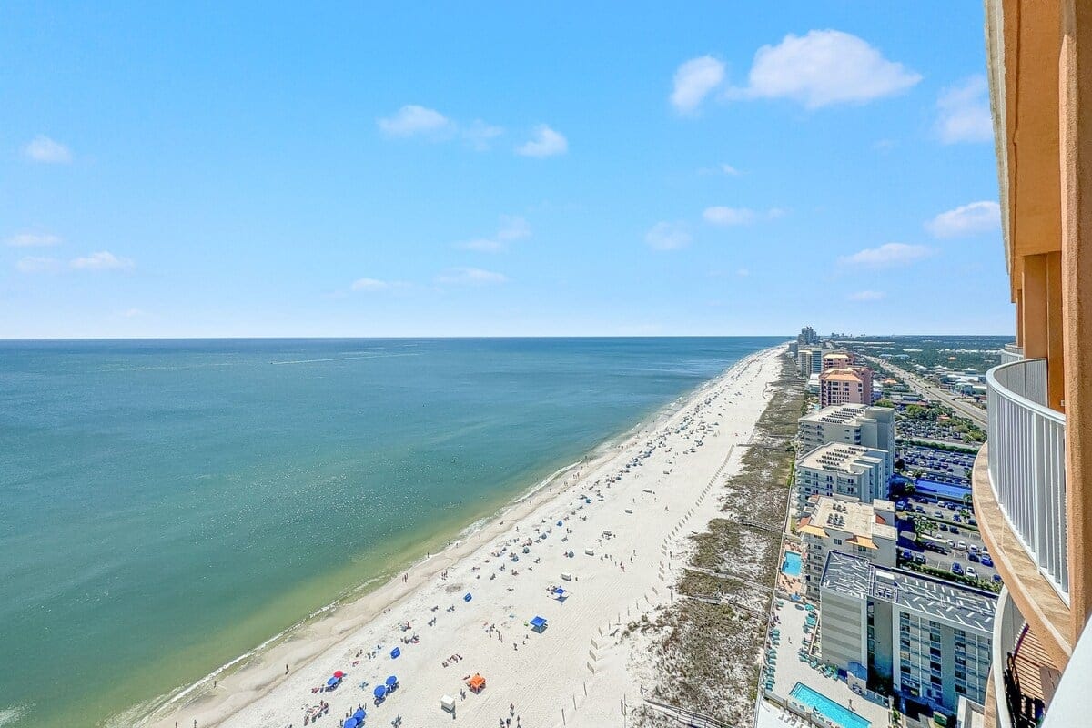 Beachfront aerial view with buildings.