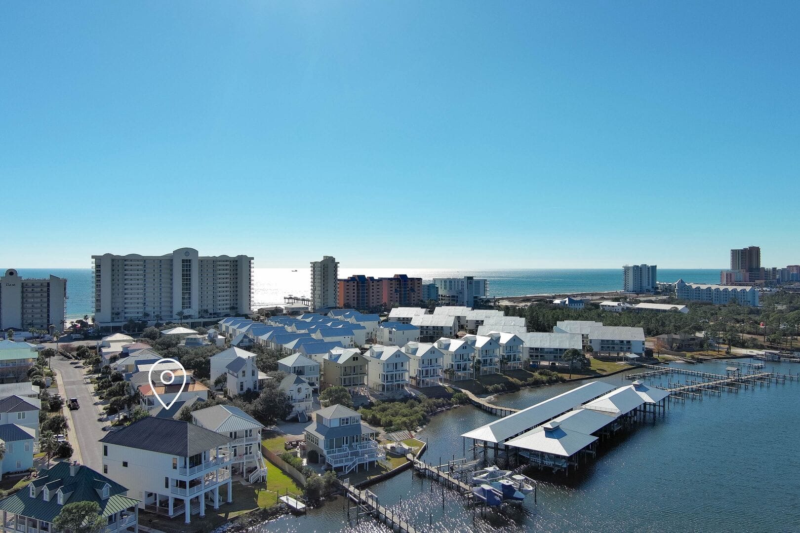 Coastal town with buildings and water.