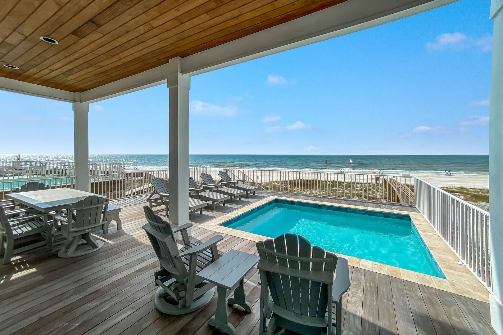 Beachside patio with pool view.