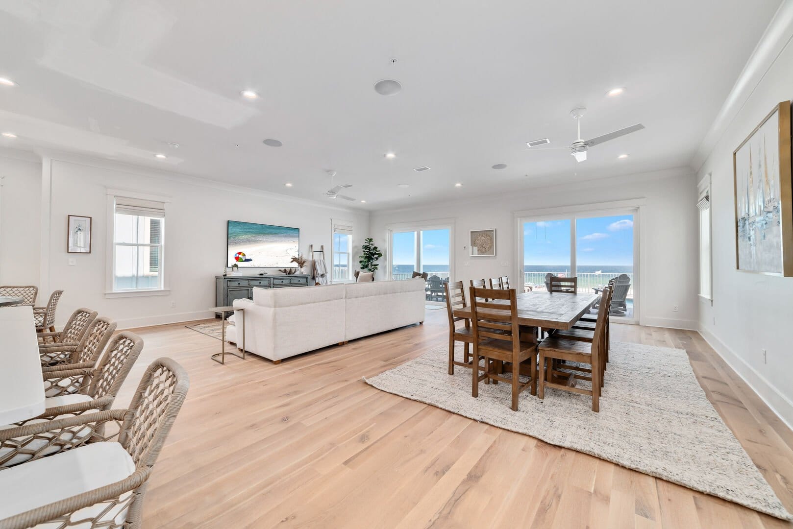 Spacious beachfront living room, dining area.