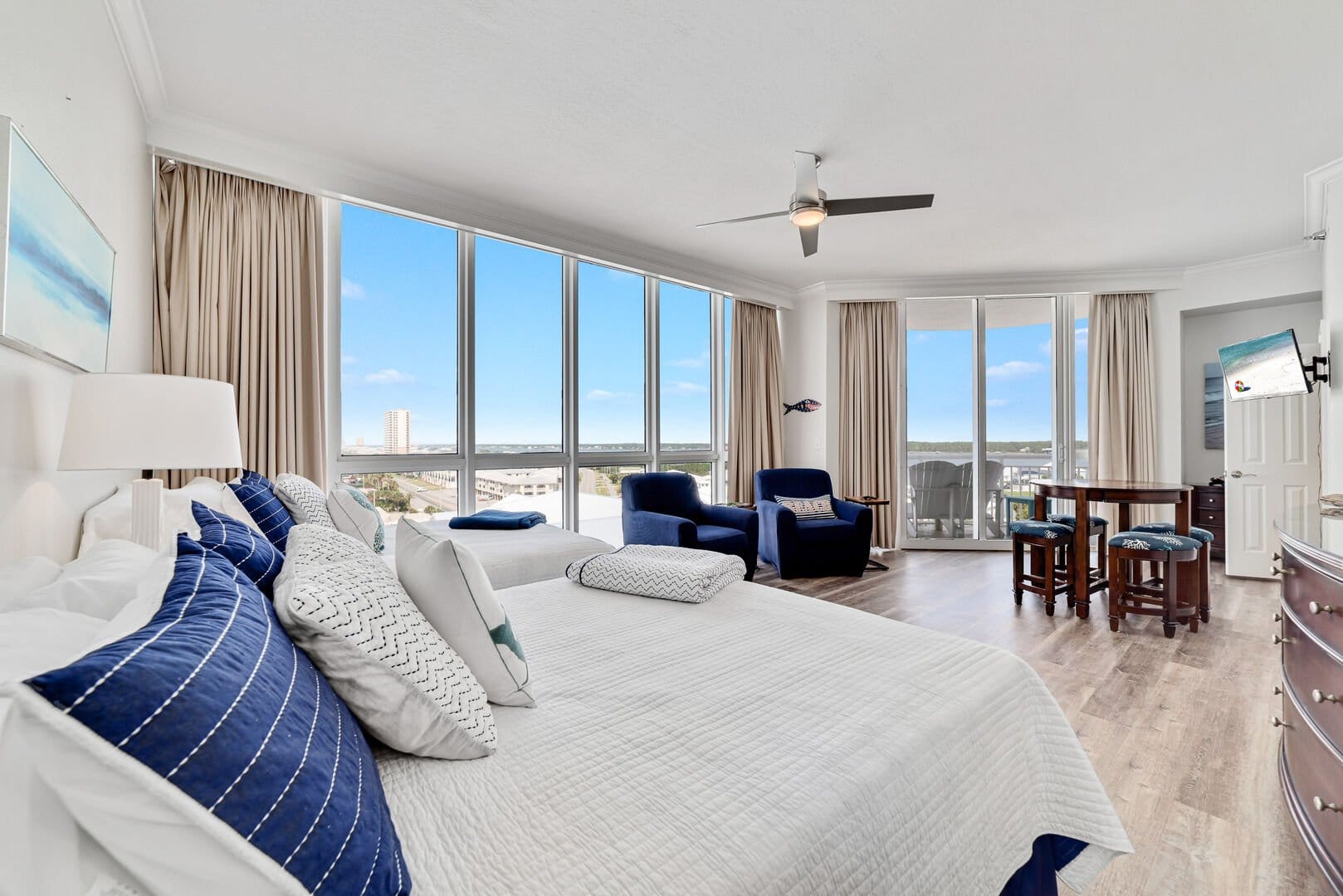 Bright bedroom with large windows.