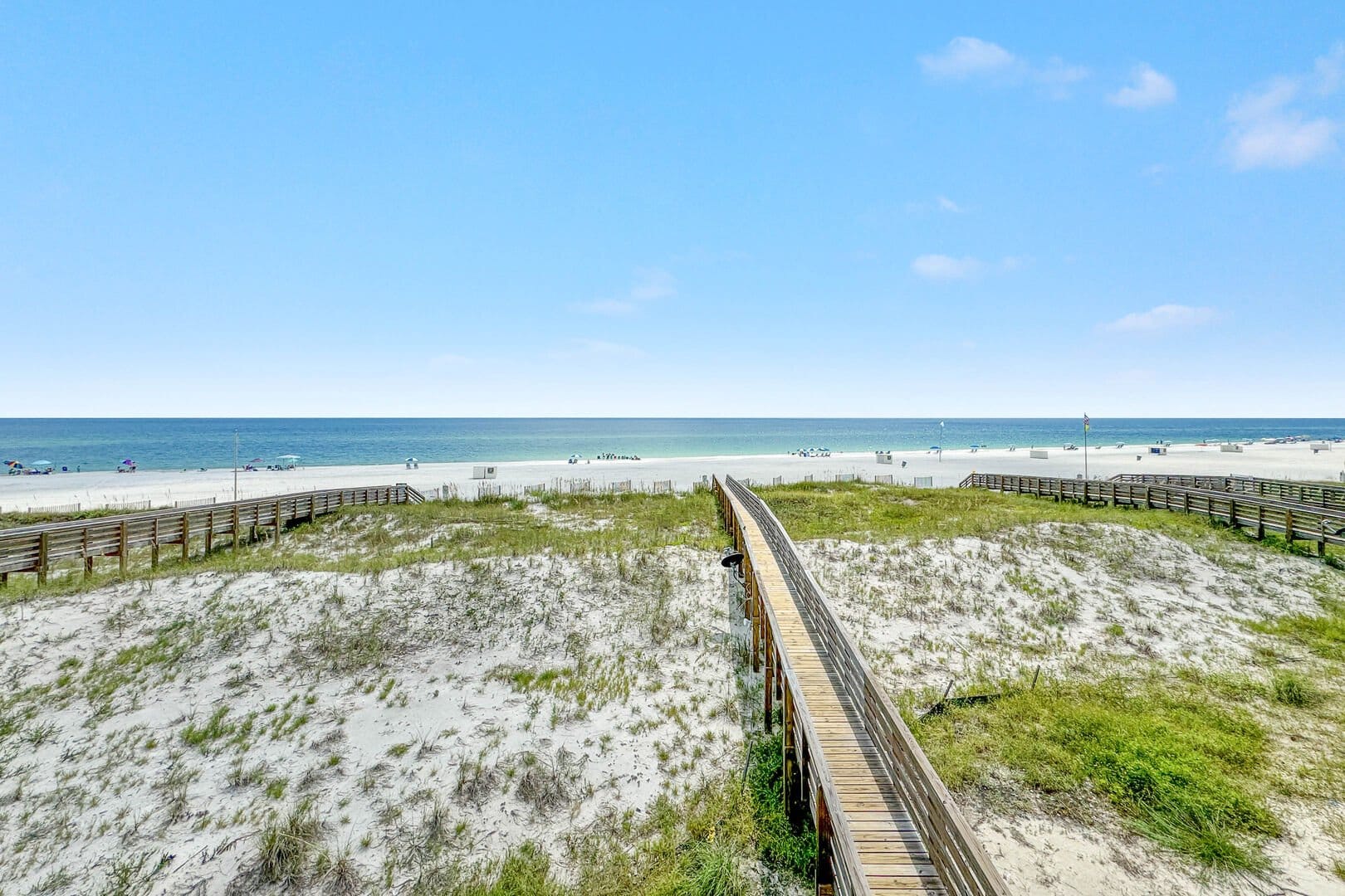 Boardwalk leading to sandy beach.