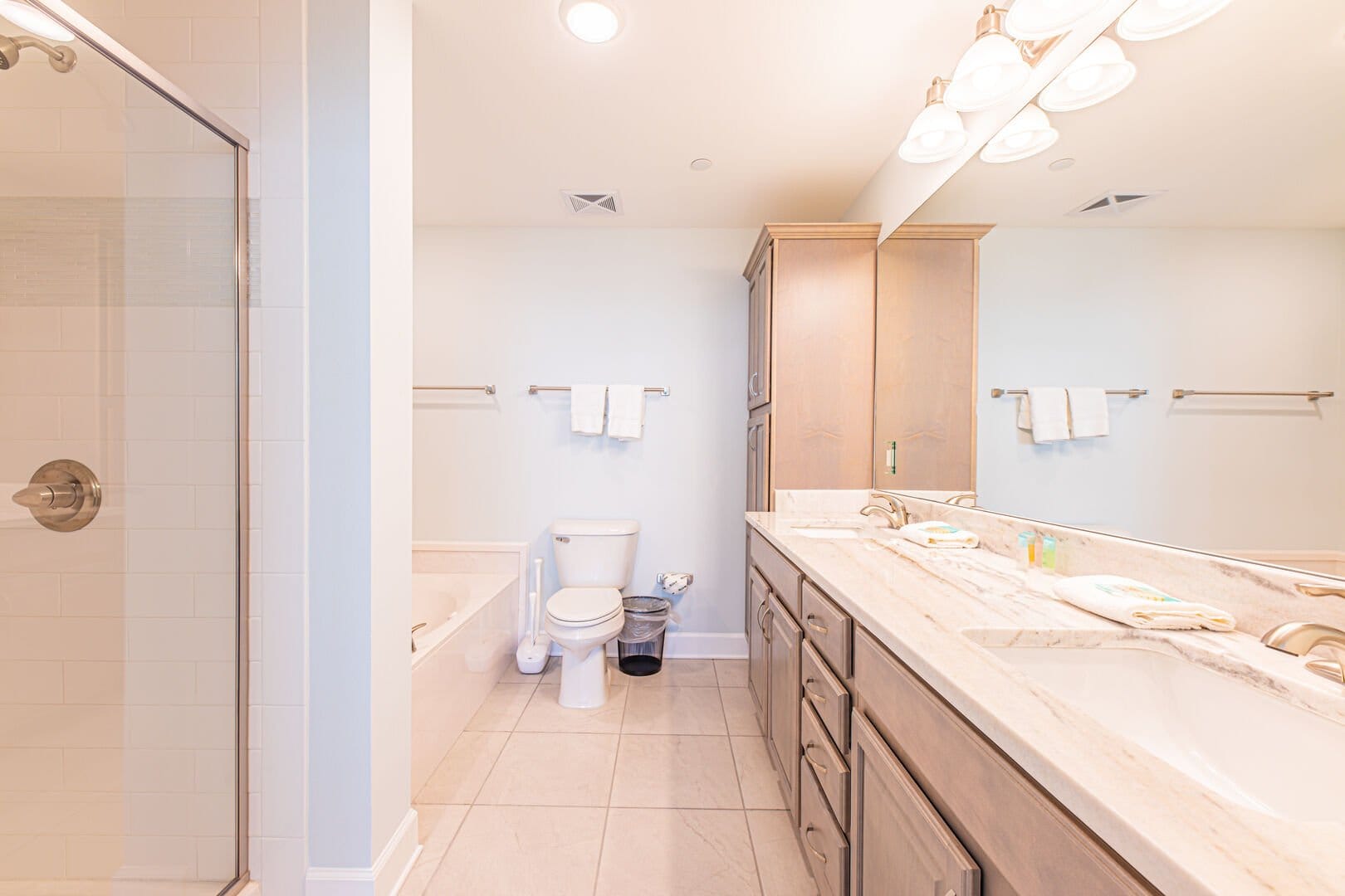 Bright bathroom with dual sinks.