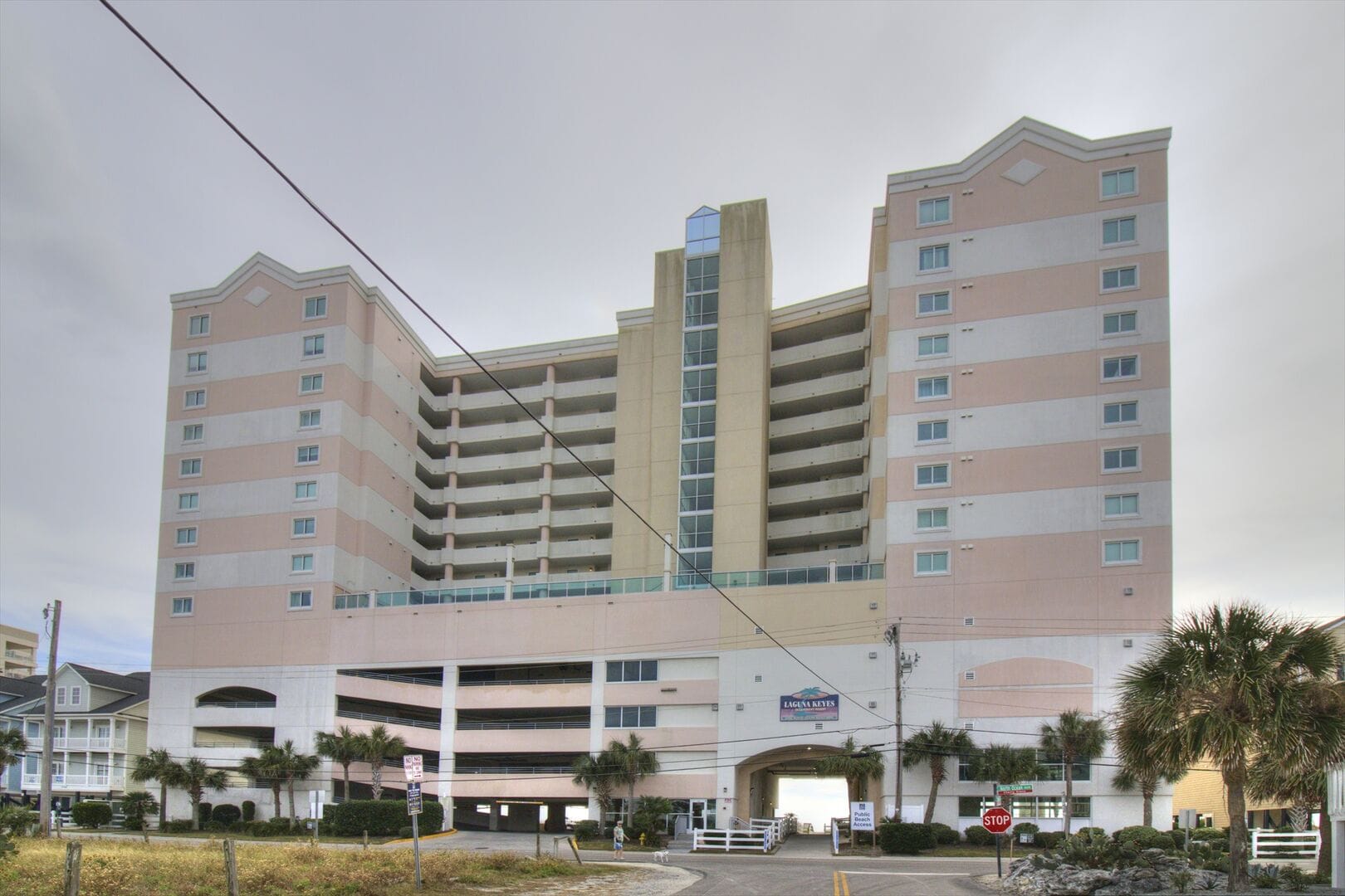 Tall residential building with balconies.