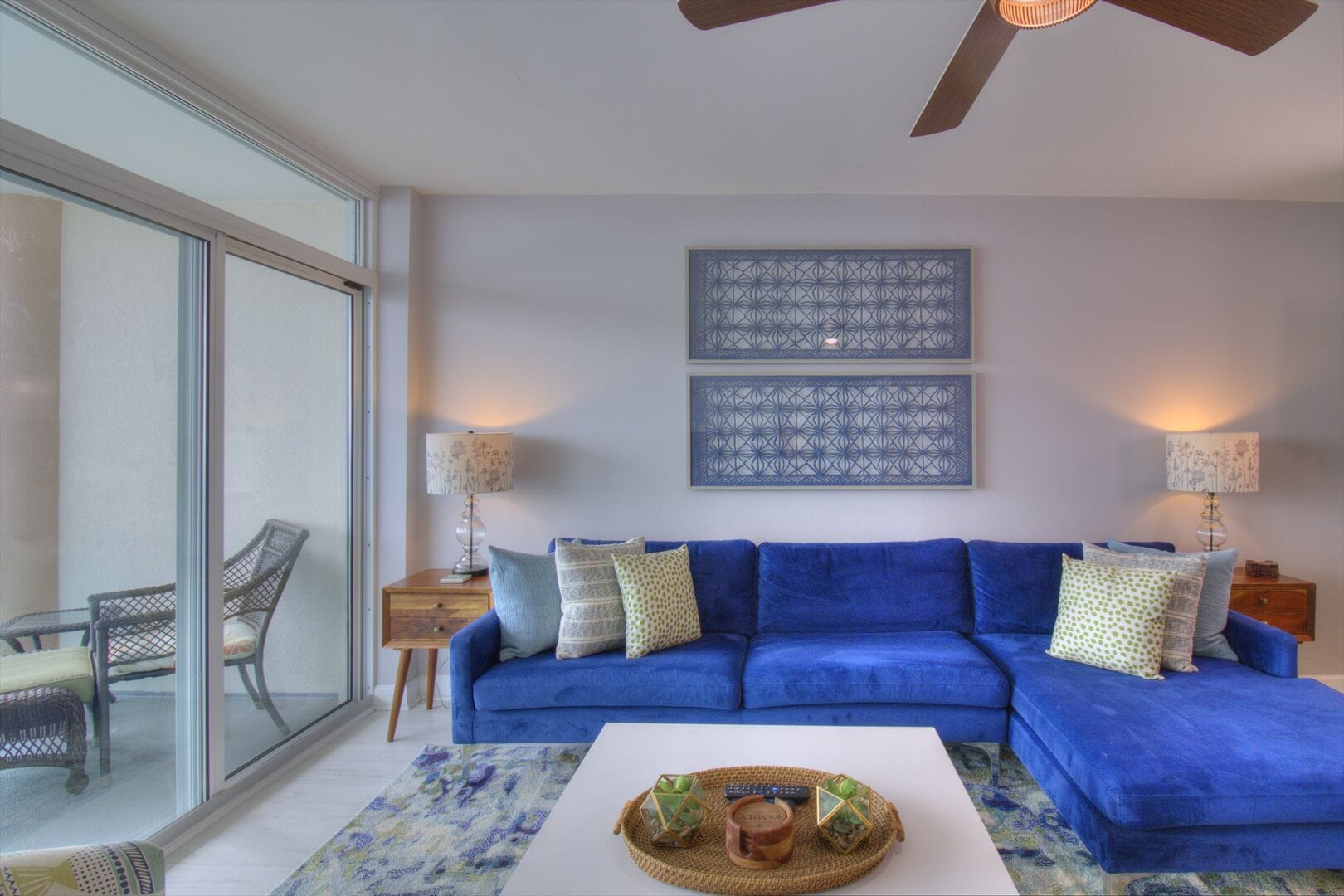 Modern living room with blue sofa.