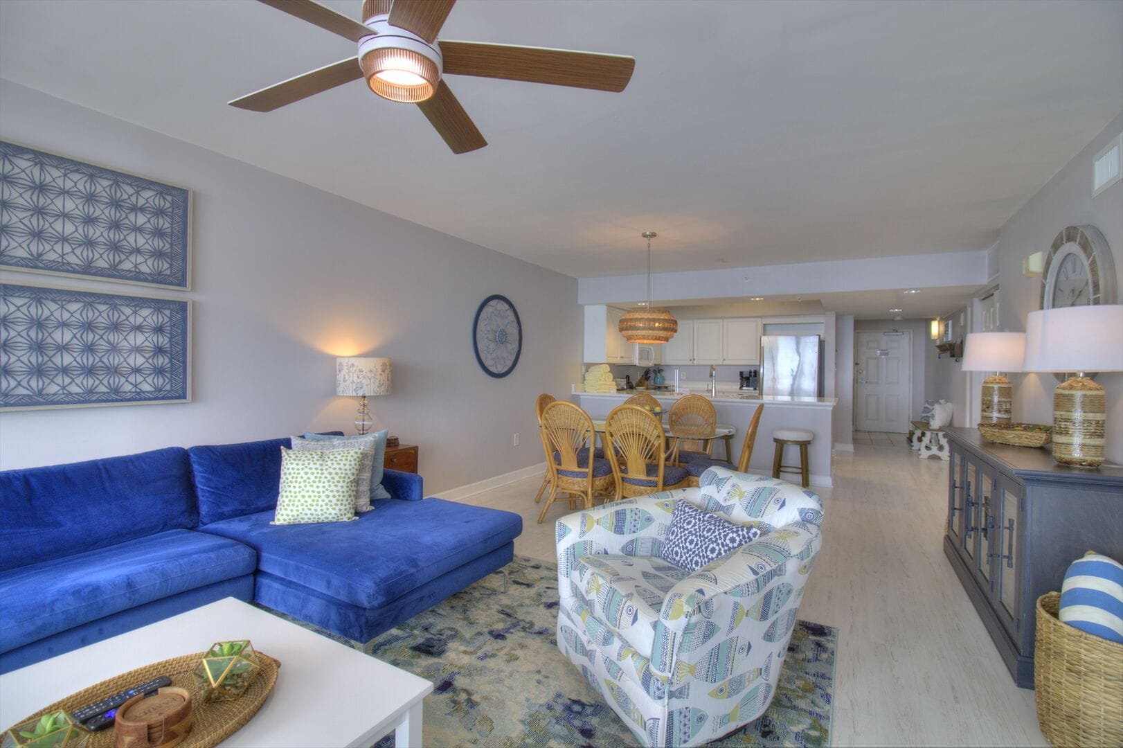 Coastal-themed living and dining area.