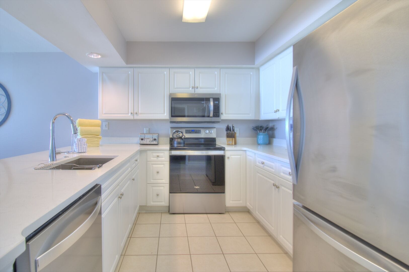 Modern kitchen with white cabinetry.