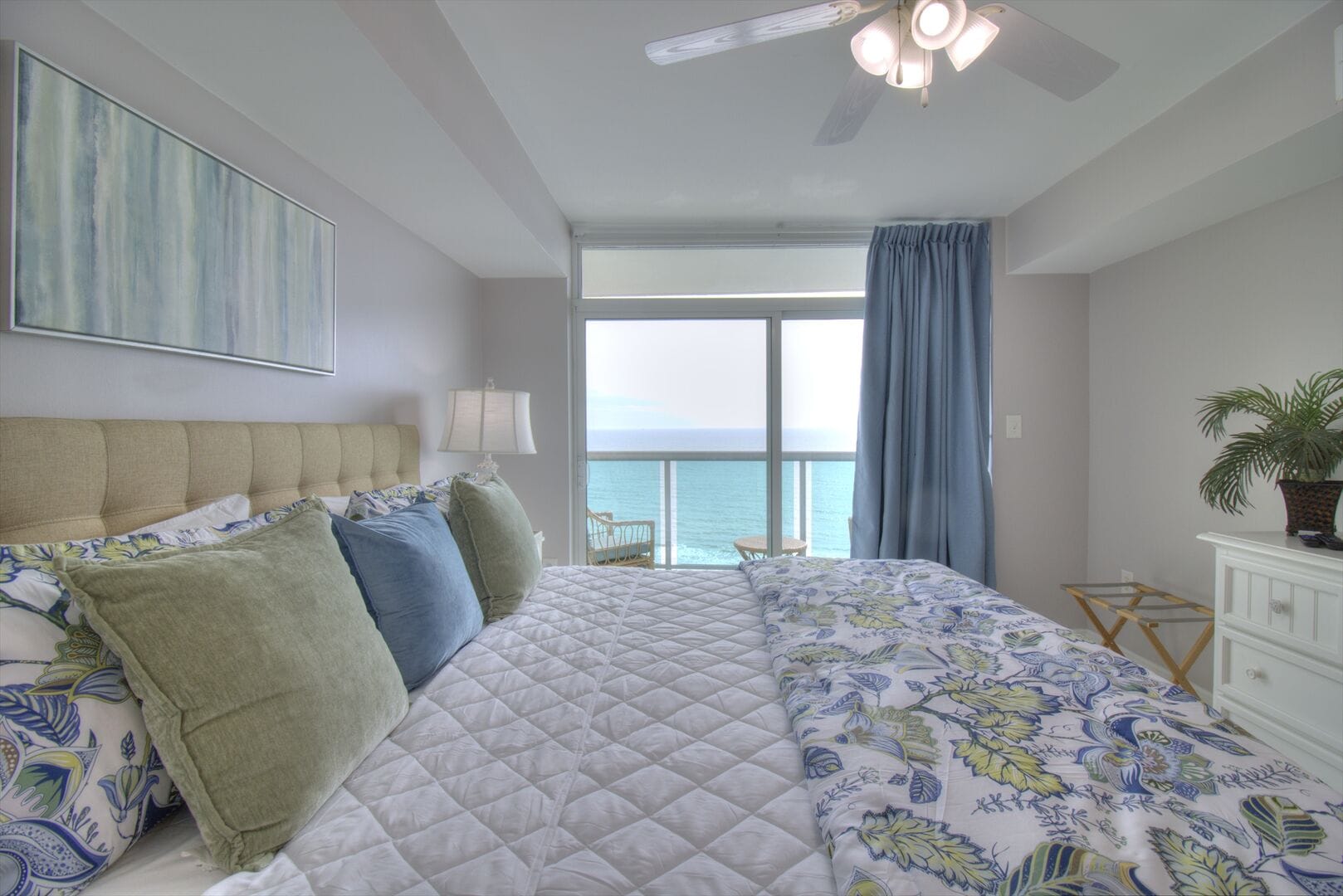 Bedroom with ocean view windows.