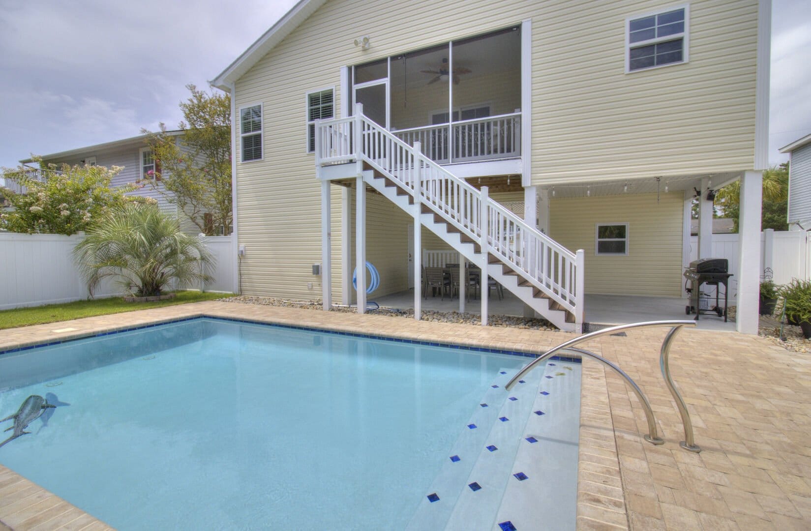 House with pool and patio.