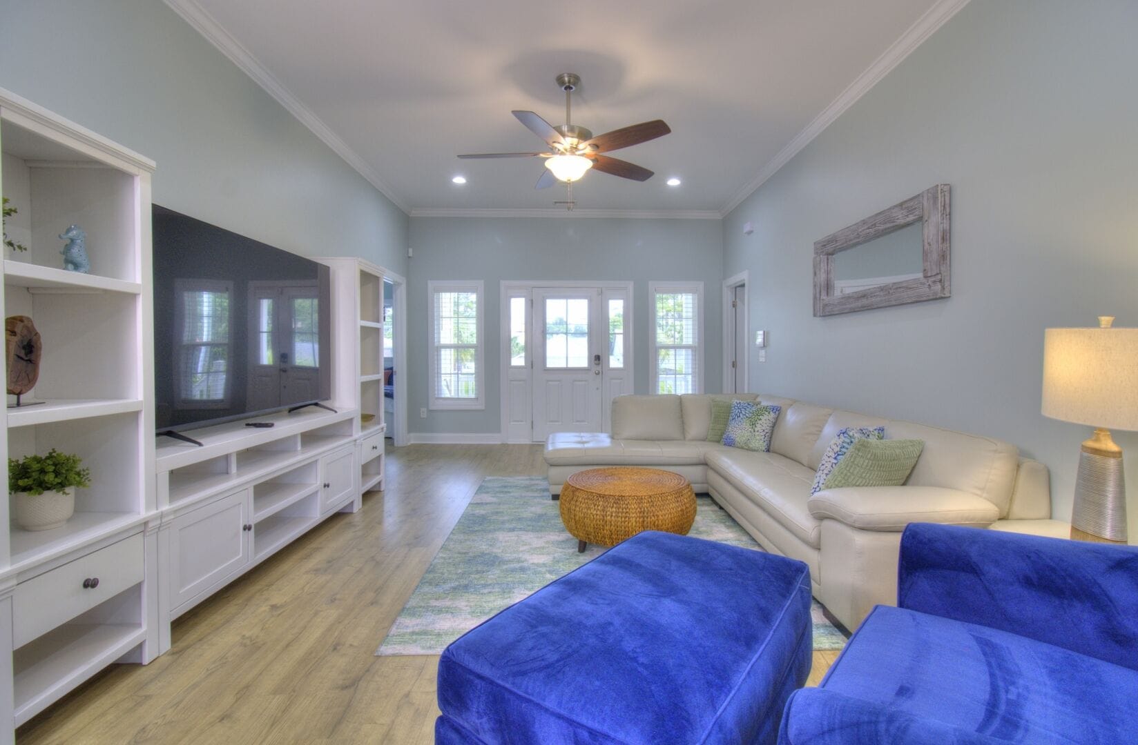 Modern living room with blue accents.