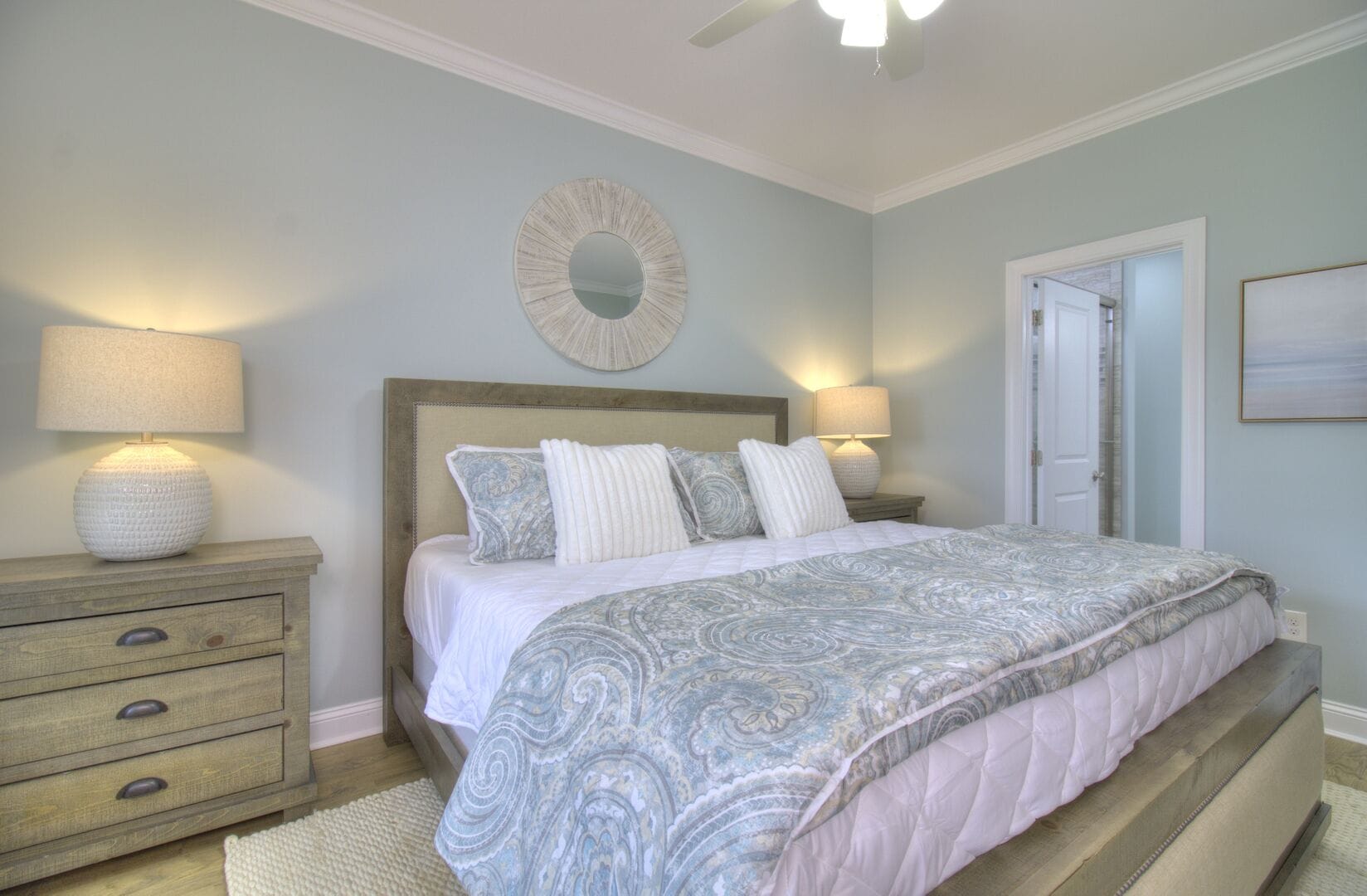 Cozy bedroom with patterned bedding.