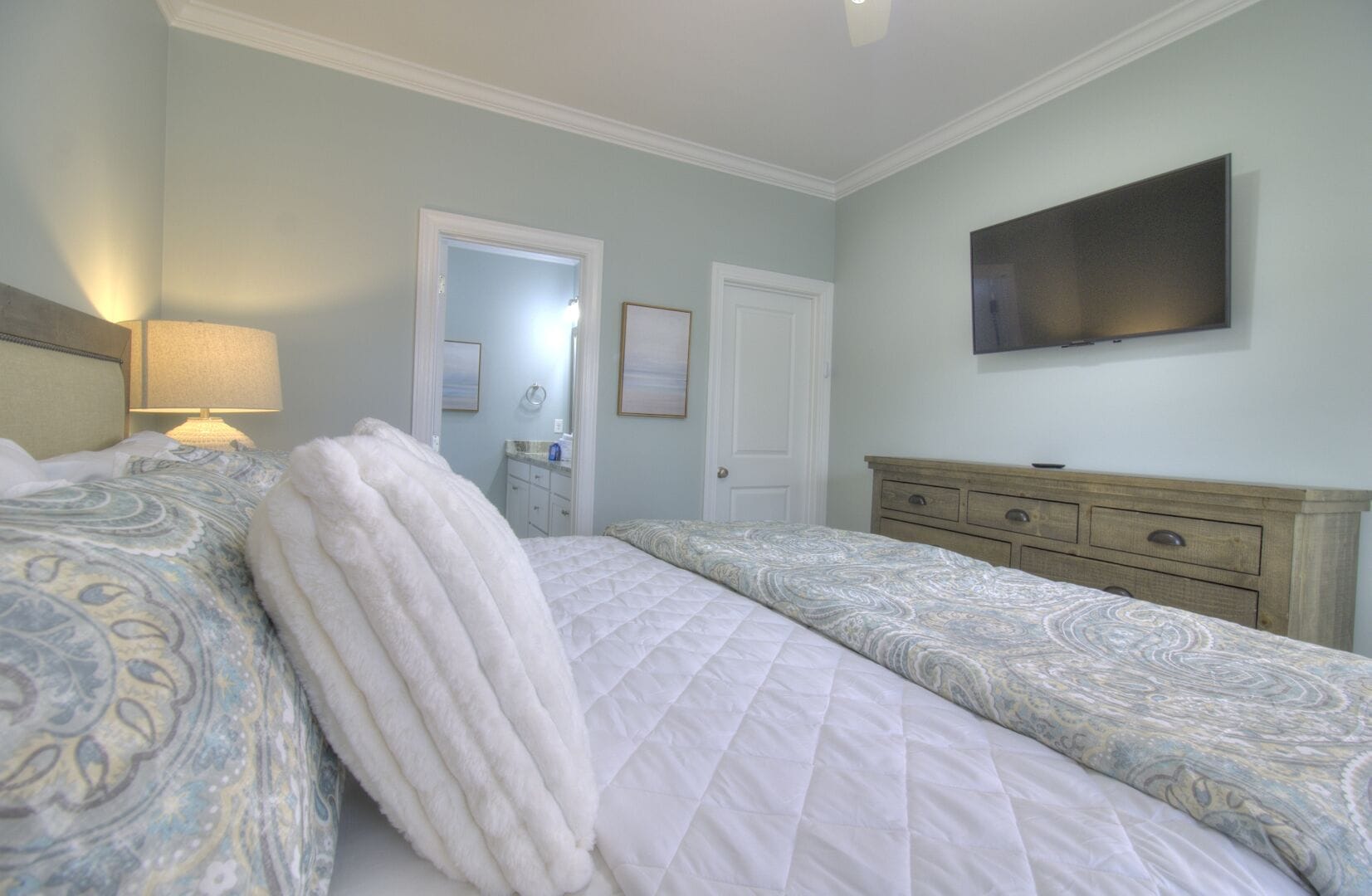 Bedroom with TV and bathroom.