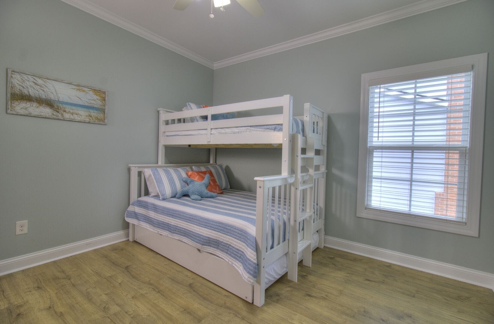 Room with bunk beds and window.