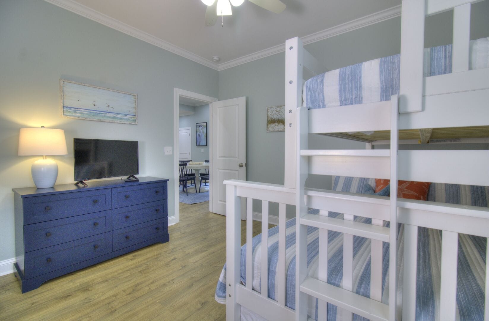 Bedroom with bunk bed and dresser.