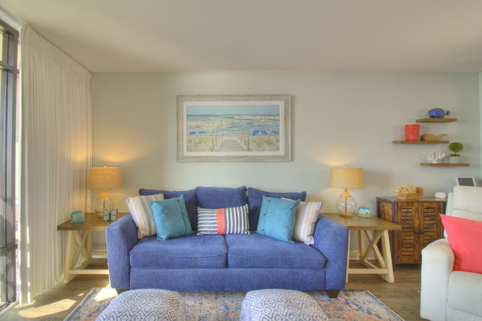 Coastal-themed living room with sofa.