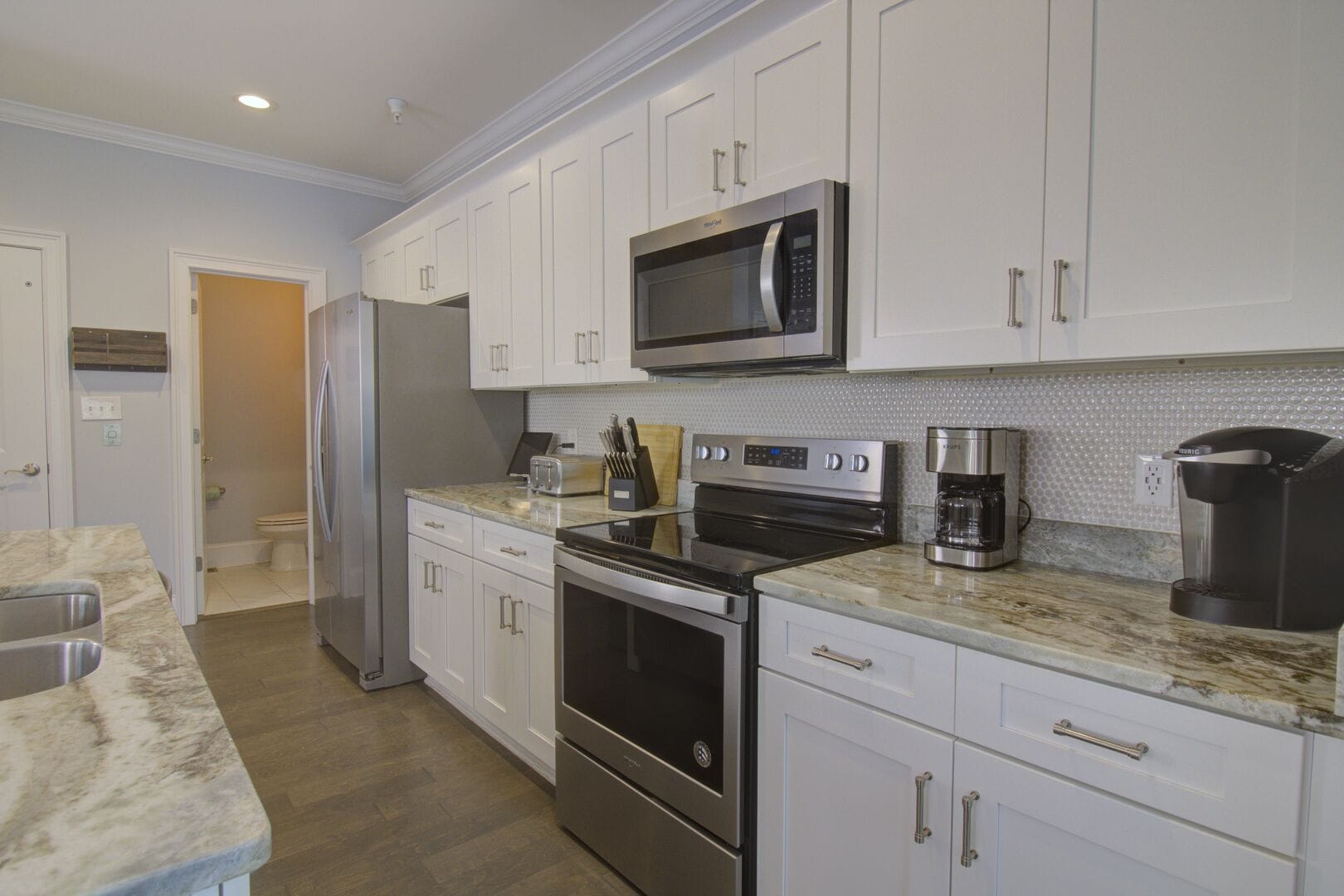 Modern kitchen with stainless steel appliances.