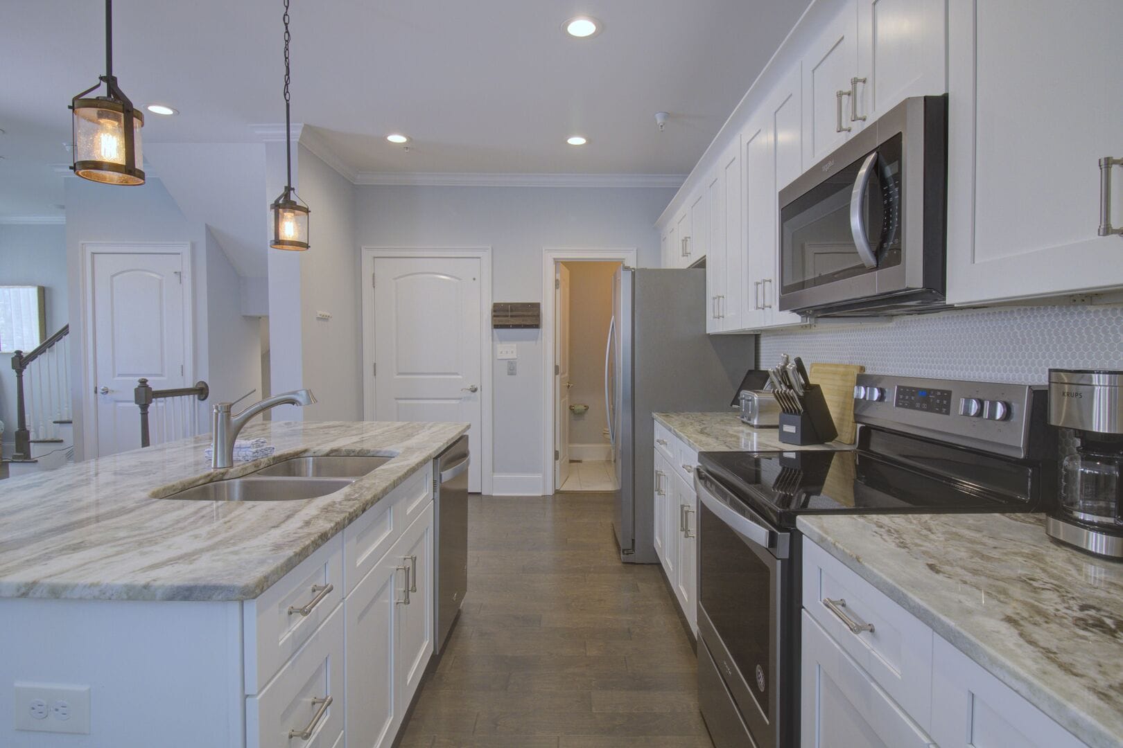 Modern kitchen with white cabinets.