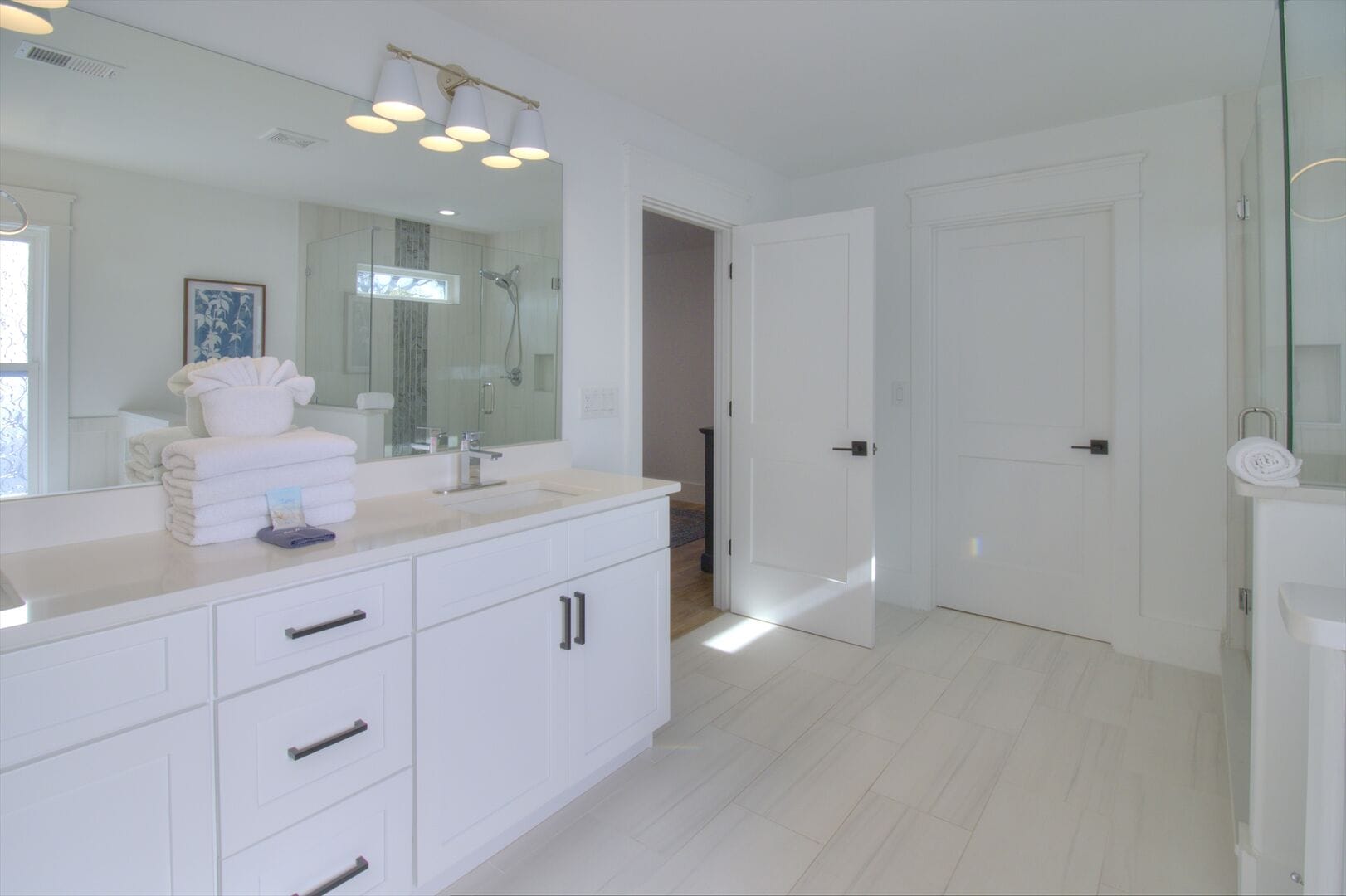 Bright, modern bathroom with vanity.