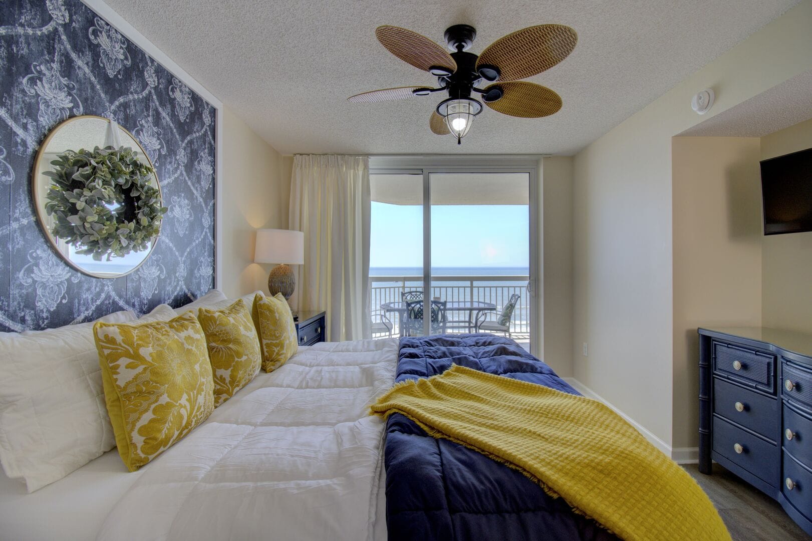 Bedroom with balcony ocean view.