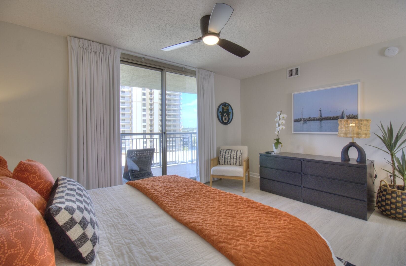 Bedroom with balcony and decor.